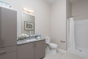 Bathroom with a huge amount of storage in the apartments at One Wall St