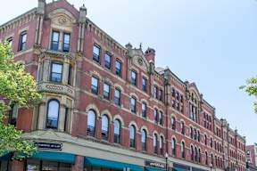 A red building with a green awning on the bottom left.