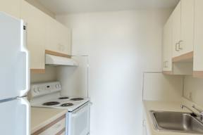 babcock tower apartment kitchen with range oven and fridge