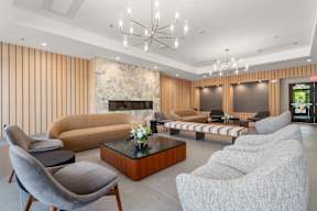 A living room with a fireplace and a sofa.