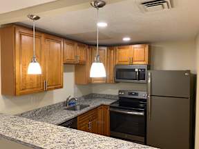 kitchen with granite countertops and new stainless steel appliances