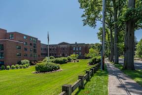 Exterior of lincoln school apartments with greenery