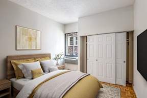 A bedroom with a bed, nightstand, and a painting on the wall.