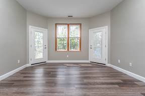 Living room with tall ceilings at Townhouse apartments in Whitman