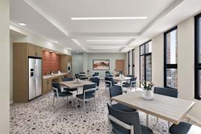 A modern community room area with a patterned floor.