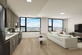 A modern apartment kitchen with a view of the city.