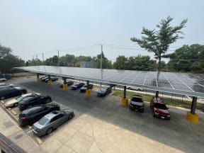 a parking lot with solar panels on the roof