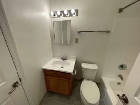 a small bathroom with a toilet sink and bathtub
