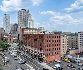 A city street with cars and buildings.
