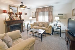a picture of a living room with different chairs and a table