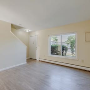 A room with a window and a door.