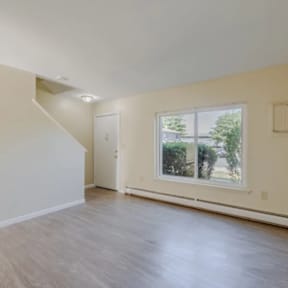 A room with a window and a door.
