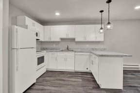 Kitchen lights and appliances with cabinets at Oakwood Manor, Bay Shore, NY 11706