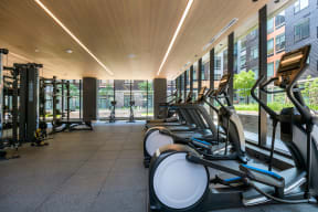 Cardio machines in fitness center at Arrowwood Apartments