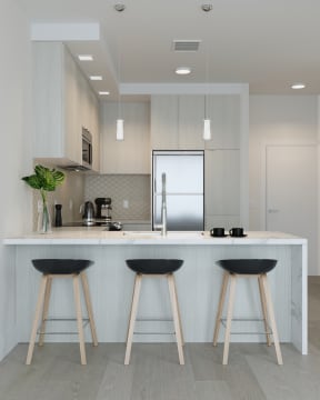 Kitchen with Light Finishes featuring Island at Arrowwood Apartments, Maryland