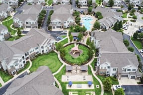 arial view of a large house with a fountain in the middle of the yard  at Kingston Crossing Apartment Homes, Bossier City, LA