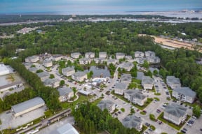 an aerial view of a city with a lake in the middle of it  at Reserve at Gulf Hills Apartment Homes, Ocean Springs, 39564