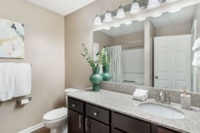 our apartments offer a bathroom with a shower  at Reserve at Gulf Hills Apartment Homes, Mississippi