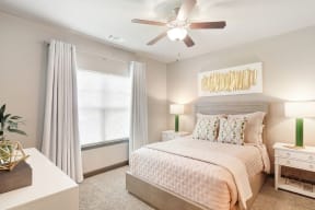 a bedroom with a bed and a ceiling fan  at Kingston Crossing Apartment Homes, Bossier City, LA, 71111