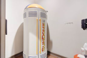 a water heater with a yellow top in a room  at Kingston Crossing Apartment Homes, Bossier City, LA