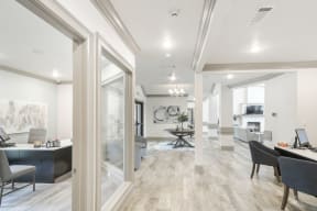 a living area with hardwood floors and white walls  at Parkwest Apartment Homes, Hattiesburg