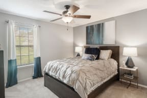 a bedroom with a bed and a ceiling fan  at Parkwest Apartment Homes, Mississippi, 39402