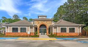 a home with a parking lot in front of it  at Reserve at Gulf Hills Apartment Homes, Mississippi, 39564