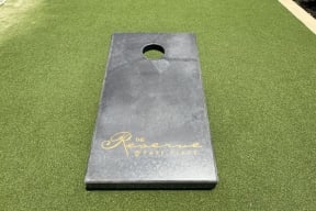 Fun Cornhole Game at Reserve at Park Place Apartment Homes, Mississippi, 39402