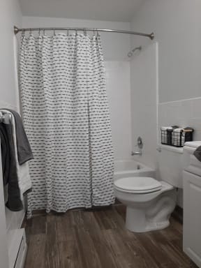 a small bathroom with a toilet and a bathtub