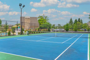tennis courts at the enclave at woodbridge apartments in sugar land, tx