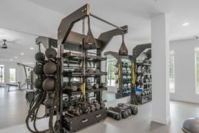 a home gym with a large collection of weights