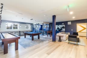 a game room with a pool table and a billiards table