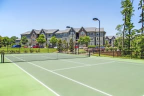 a tennis court with apartments in the background at Century Lakeshore Crossings, Birmingham, 35211