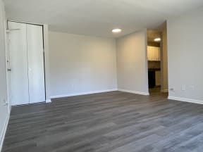 Renovated apartment with wood-like flooring at Barracks West apartments in Charlottesville, VA