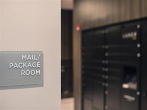 Mail/package room with individual secure mail boxes at Lofts at South Lake at Lofts at South Lake, Clermont, FL, 34711