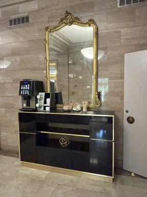 A dresser with attached mirror at Land Bank Lofts in Columbia, SC