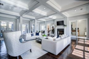 a large living room with white furniture and a fireplace at Century Lakeshore Crossings, Alabama, 35211