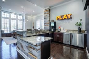 a large kitchen with a play sign on the wall at Century Lakeshore Crossings, Birmingham, AL