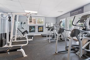 Fitness center with windows and natural light at Barracks West in Charlottesville, VA