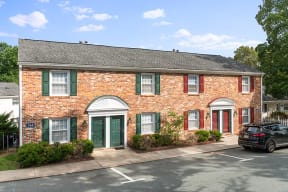Bick with green doors and window treatment at Barracks West in Charlottesville, VA