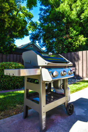 a bbq grill in a backyard