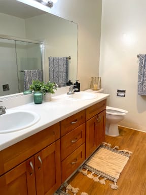 Double sink with toilet and small plants Exterior of the building with lots of Greenery Prodesse Property Group 418 Brahms Way Sunnyvale CA 94087