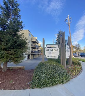 an apartment complex with a sign that says agena apartments