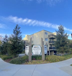 an apartment building with a sign that says argenta apartments
