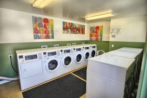 Laundry room with washer and dryers