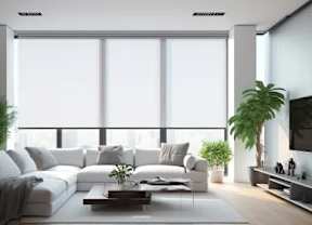 A modern living room with a white sofa, a coffee table, and a large window.