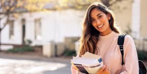 girl with books on campus