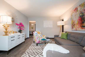 Bright Open Den Living Space with Wood Plank Vinyl Flooring Amble Room for Couches and Furniture at Artesian East Village, Atlanta, GA 30316