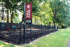 A sign for Dog Park The Edge is shown.