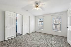 A room with a ceiling fan and a window with blinds at Country Lane, Cheyenne, Wyoming